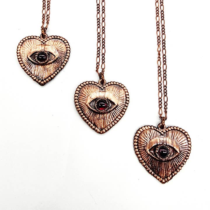 Love Is Watching Garnet Heart Necklace for wholesale by MergingMetals