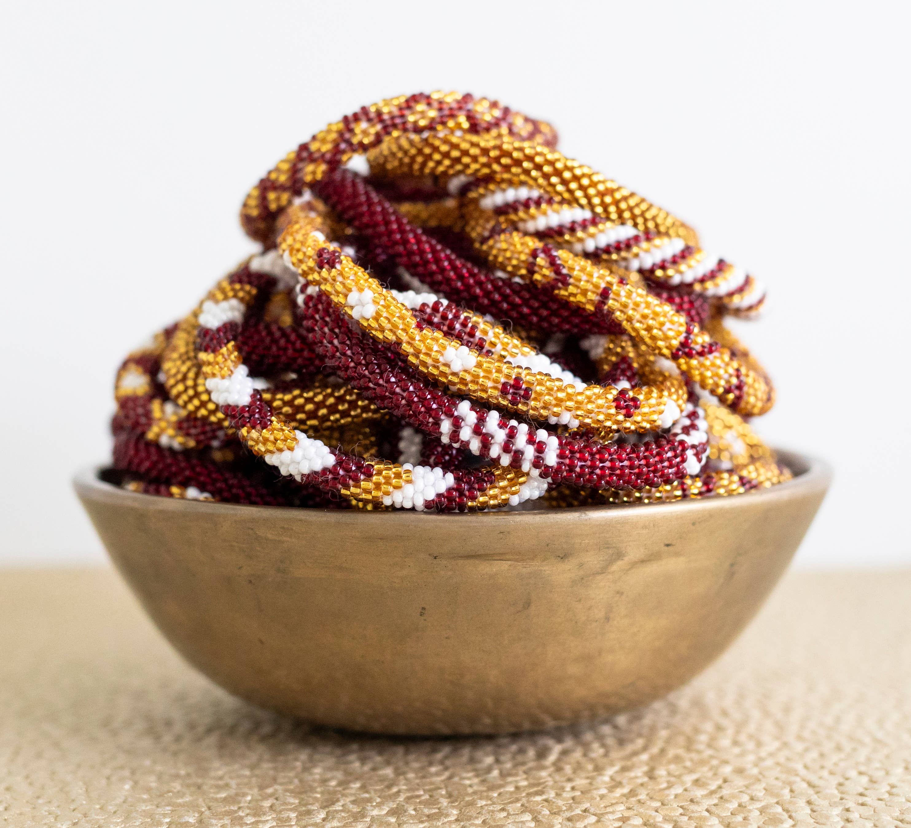 Aid Through Trade - Wholesale Jewelry Set - Roll-On® Game Day Bracelet Burgundy and Gold - Set of 121