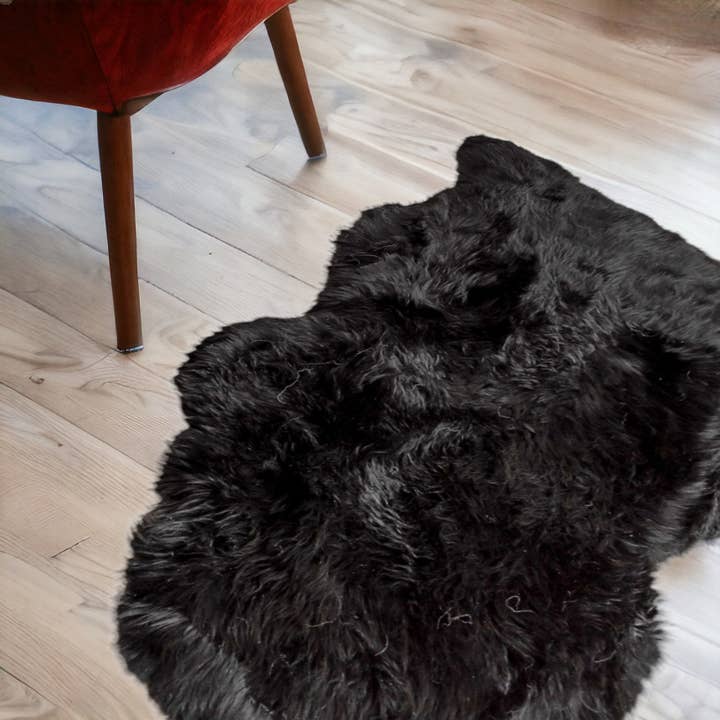 2' X 3' Black New Zealand Natural Sheepskin Rug for wholesale by HomeRoots