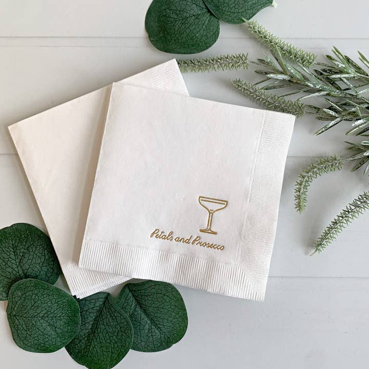 EnFete, LLC - Wholesale Disposable Napkin - Petals and Prosecco Gold on White Cocktail | Set 16