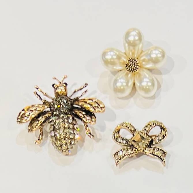 Set of 3 gold pins: bee, flower, and bow for wholesale by Bijoux 7bis