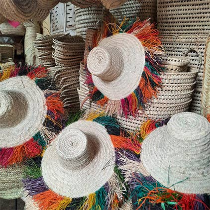 Moroccan Beach Straw Hat With colorful Raffia frings for wholesale by MARRAKECH METACRAFT LTD