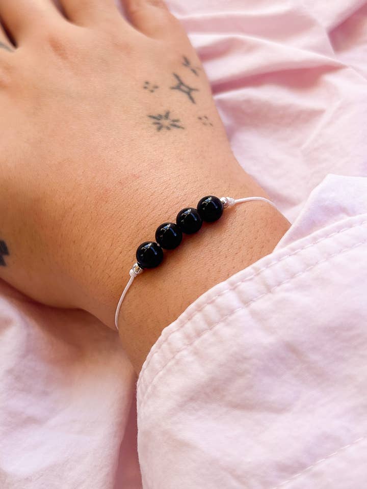 Braccialetto in cordoncino di ossidiana, braccialetto per protezione e radicamento per la vendita all'ingrosso da parte di Nevele Official