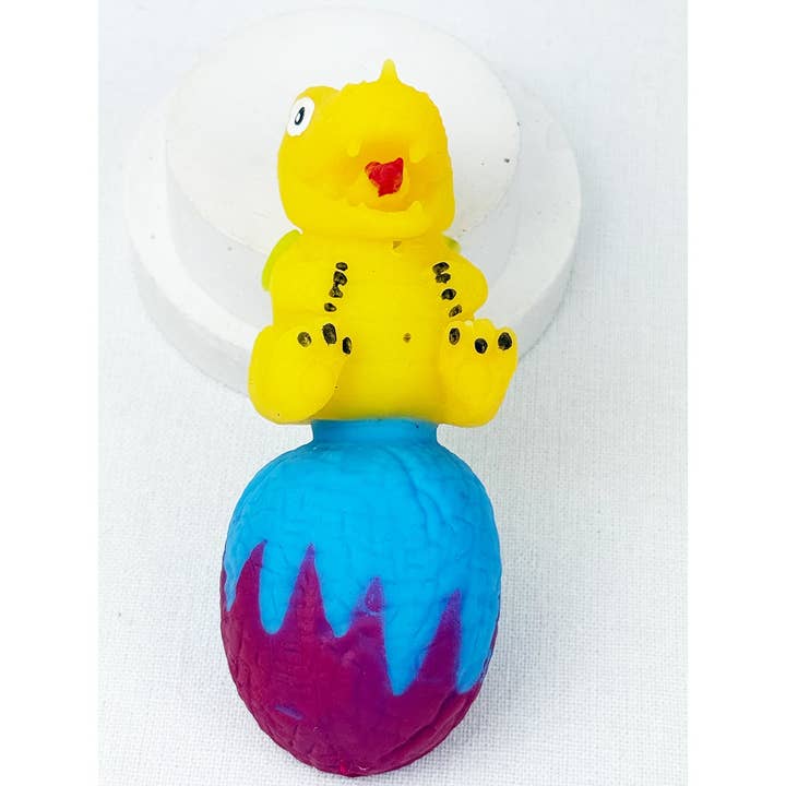 MIX COLOR Treasure Box Reversible Dinosaur Egg Squishies for wholesale on Faire