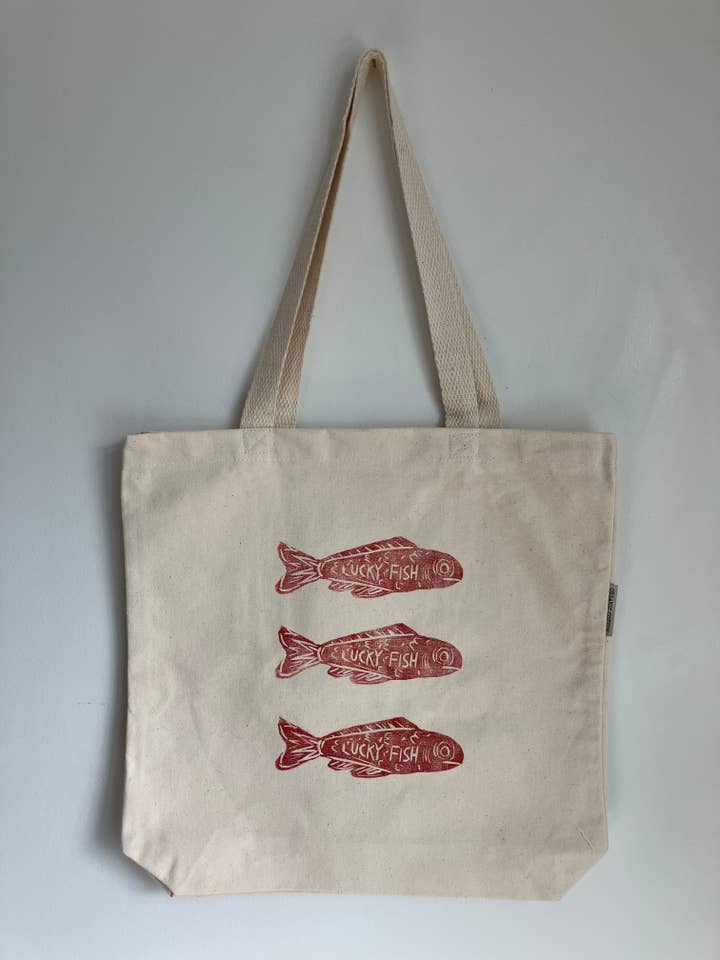 Handprinted linocut tote bag with Fish for wholesale by Ladyfine Collective