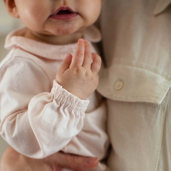 Angelic Muslin Collar Infant Girl Jumpsuit
for wholesale on Faire4