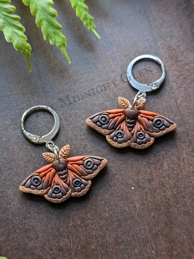 Emperor Moth Huggie Hoops for wholesale by The Midnight Glen