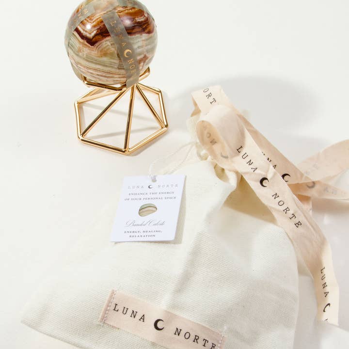 Luna Norte - Wholesale Spiritual Stone/Crystal - Banded Calcite Sphere Curio with Stand