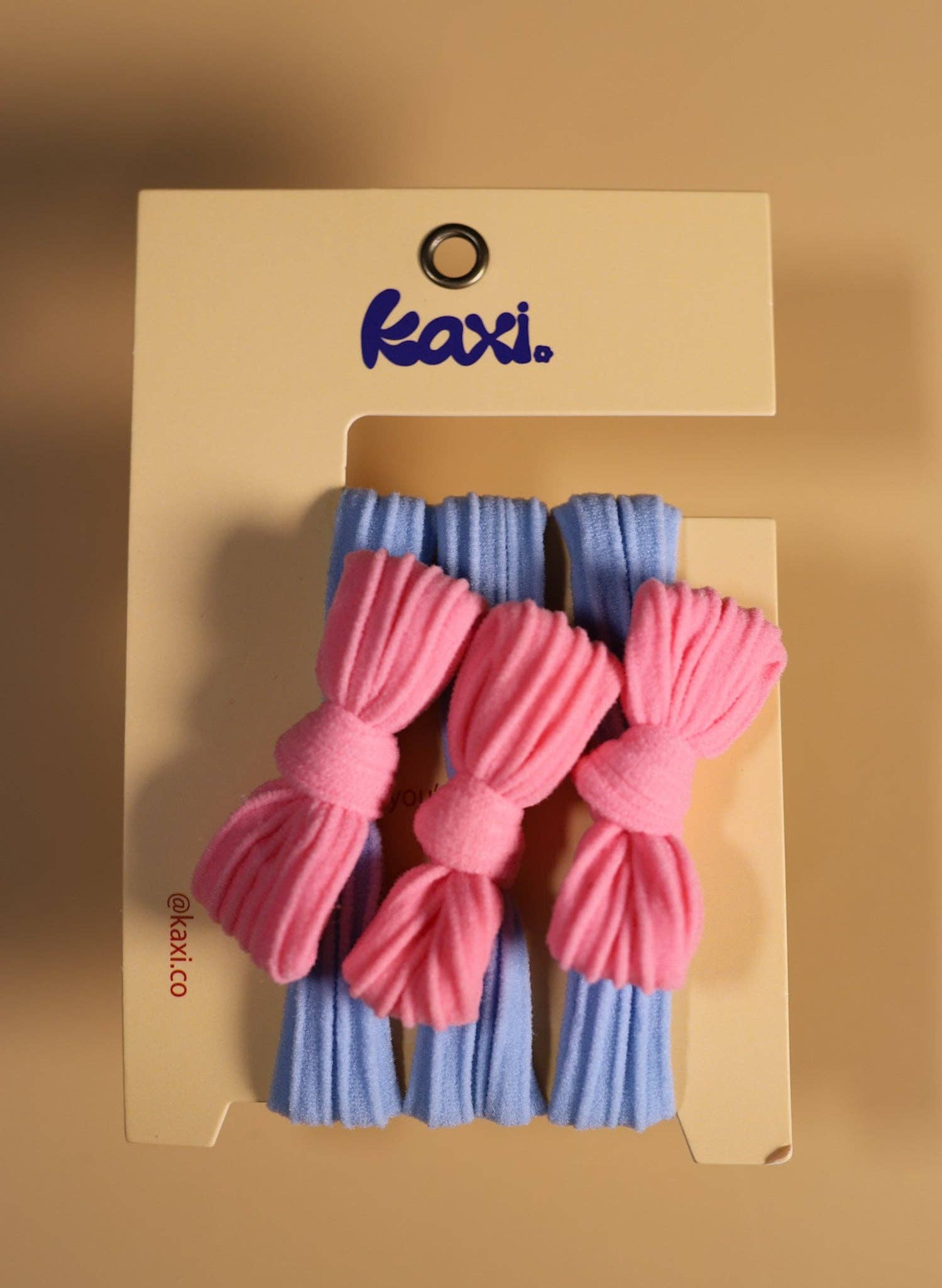 KAXI – wholesale Hårsnoddar – Dam – Tvåfärgade rosetter med bakåtslickat hårband2