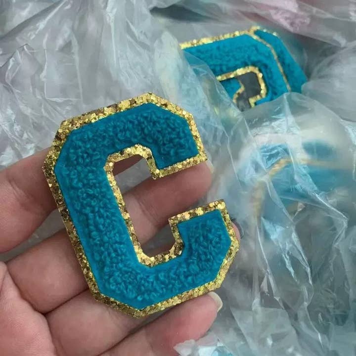 Aqua Blue Iron-On Varsity Chenille Patch with Gold Glitter for wholesale by Raphael wonders