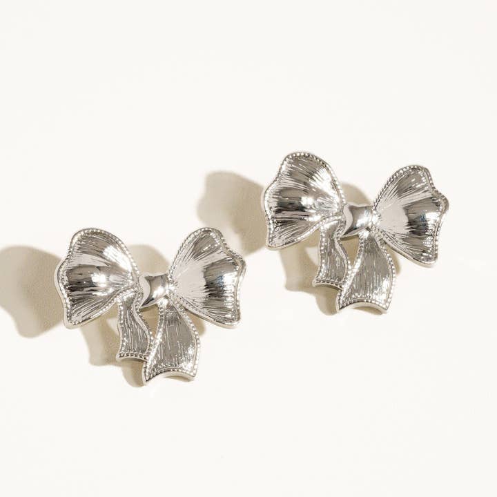 Glint Silver Glitter Bow Earring for wholesale on Faire