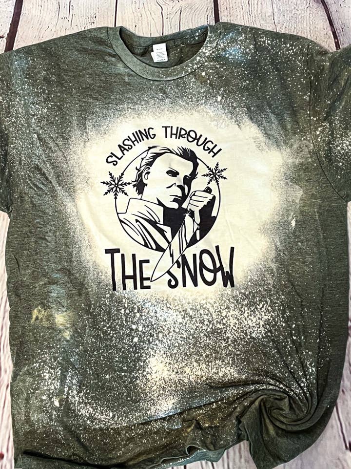 Slashing Through The Snow Halloween Holiday Tee for wholesale by MM Custom Apparel