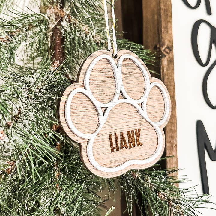 Paw Print Christmas Ornament for wholesale by Dakota + Pine Design Co.