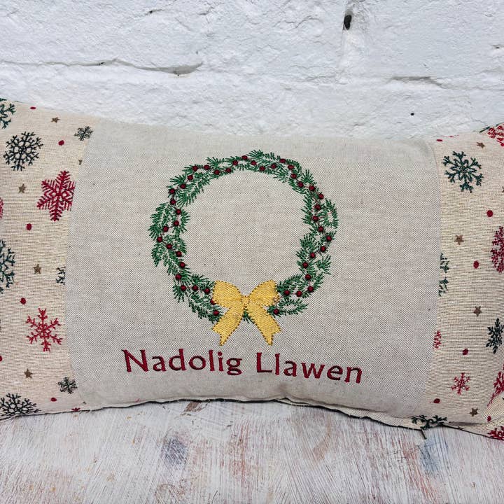 Christmas Wreath Nadolig llawen Gold Snowflake Cushion . for wholesale by Lizzie Dixon Designs