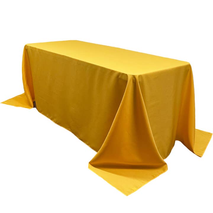 90 x 132 inch Polyester Rectangular Tablecloth Gold for wholesale by YOUR CHAIR COVERS