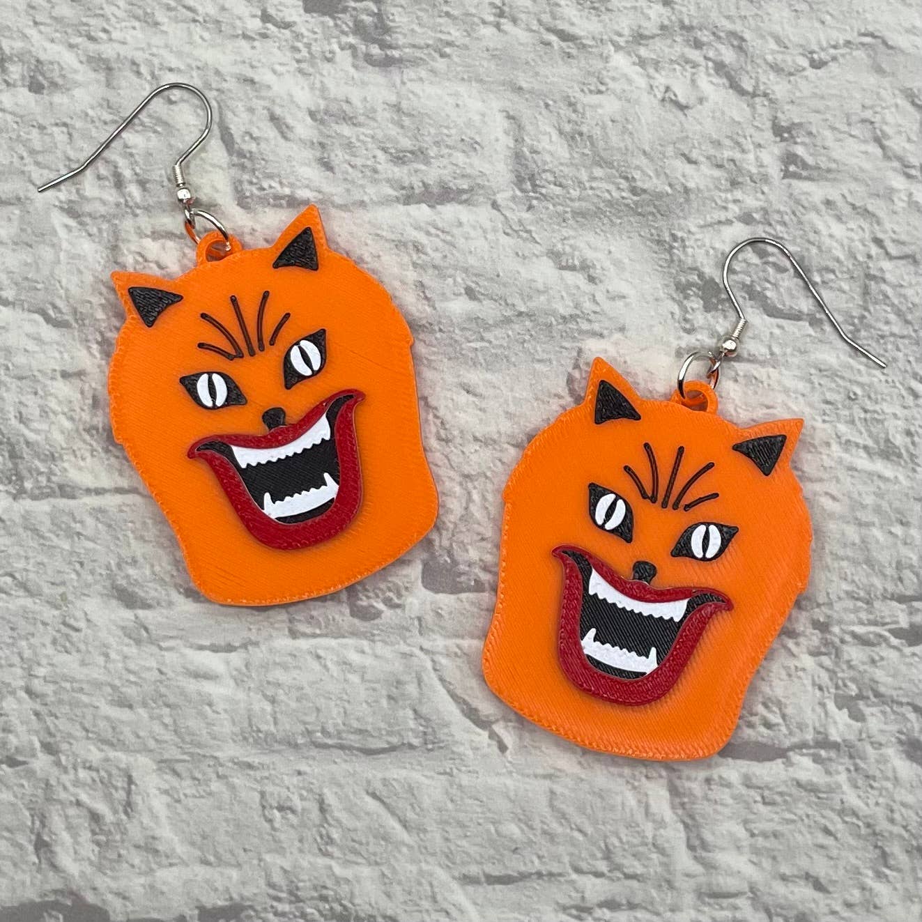 Cryptid Craft Studio - Wholesale Dangle Earrings - Hausu Orange Cat Horror Statement Earrings 3D Printed2