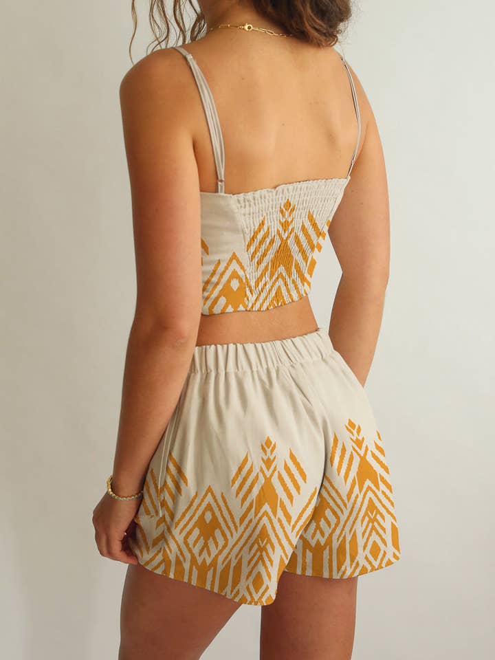 Gold Symmetrical Print on Blanc Amber Crop Top and Shorts Set for wholesale on Faire2