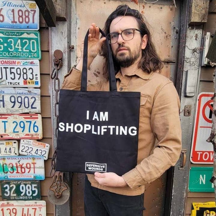 I AM SHOPLIFTING Double Sided tote for wholesale by Defensive Wounds