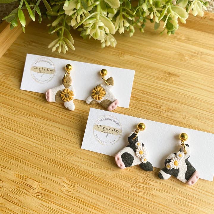 Clay by Day Designs - Wholesale Dangle Earrings - Floral Crown Cow. Country western - polymer clay earringÂ