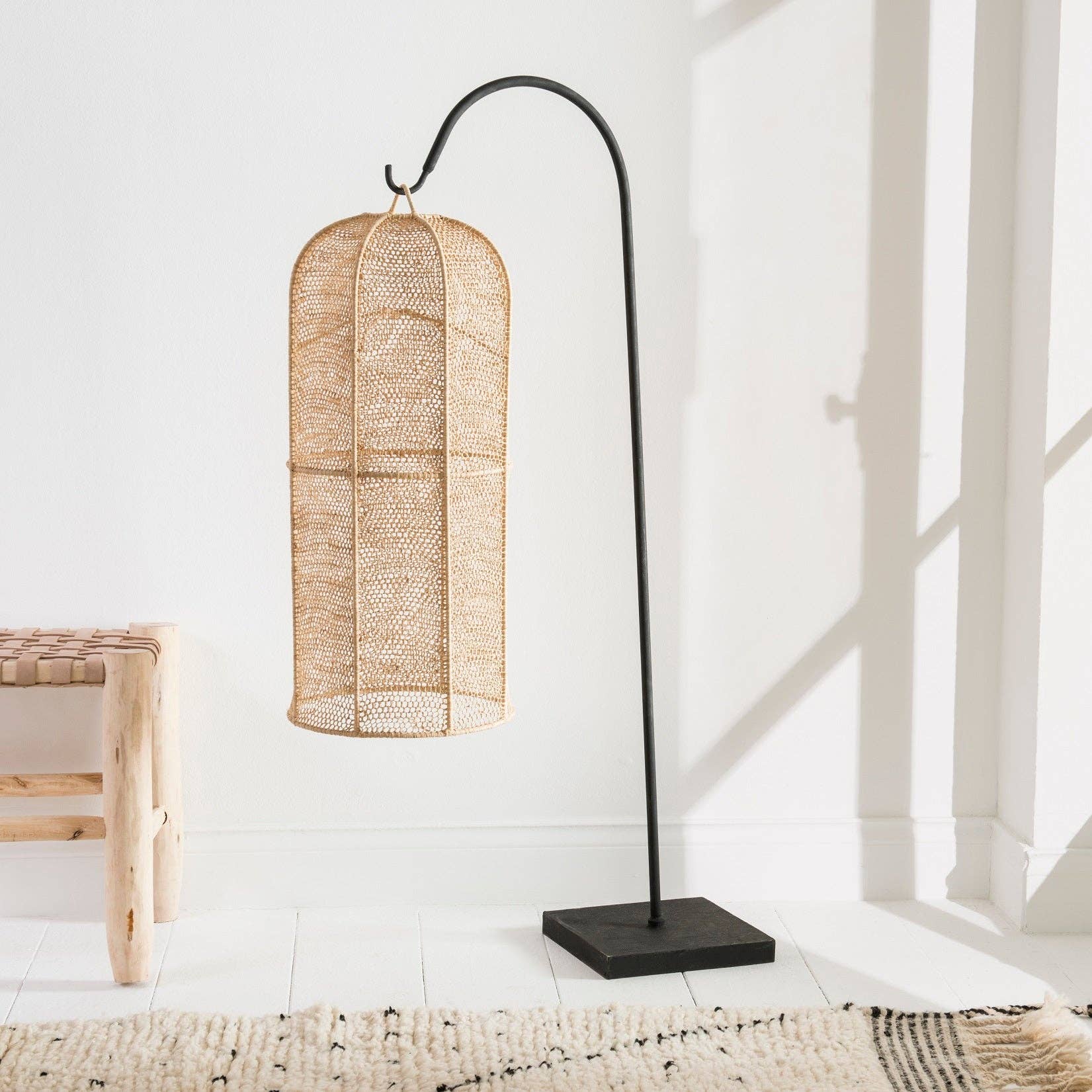 Small suspension made from ntural raffia popular and wrought iron .