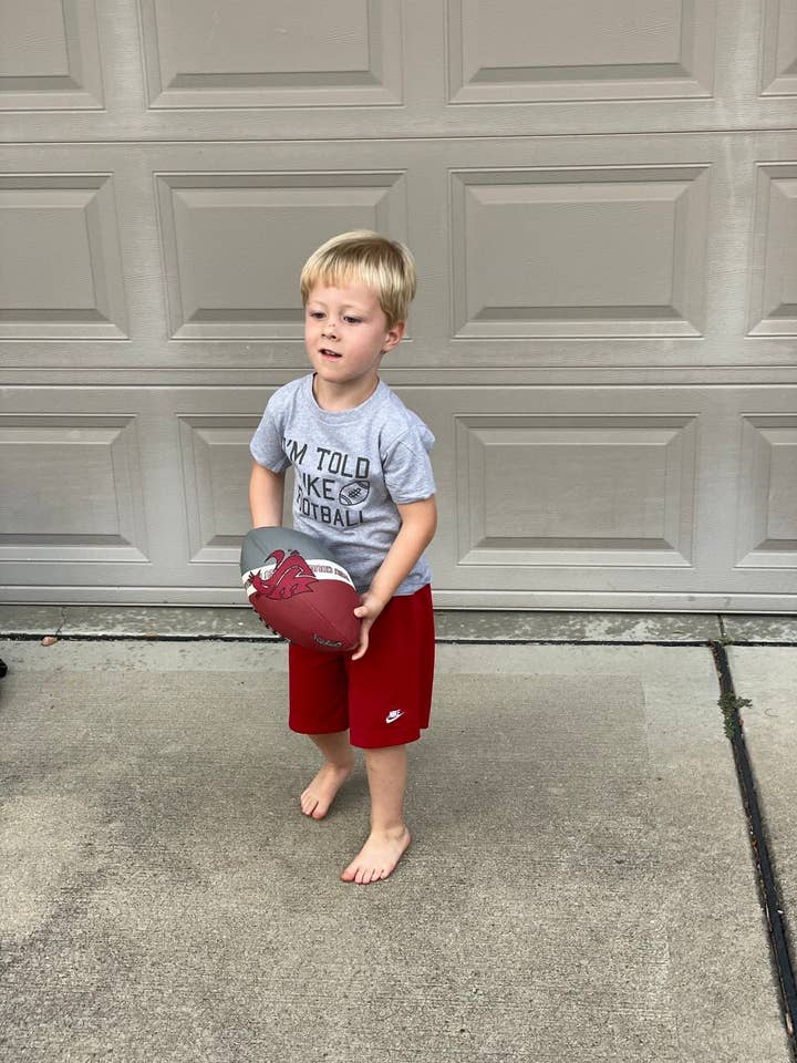 I'm Told I Like Football | Toddler Tee | Gray and Black for wholesale by Charlie Rae