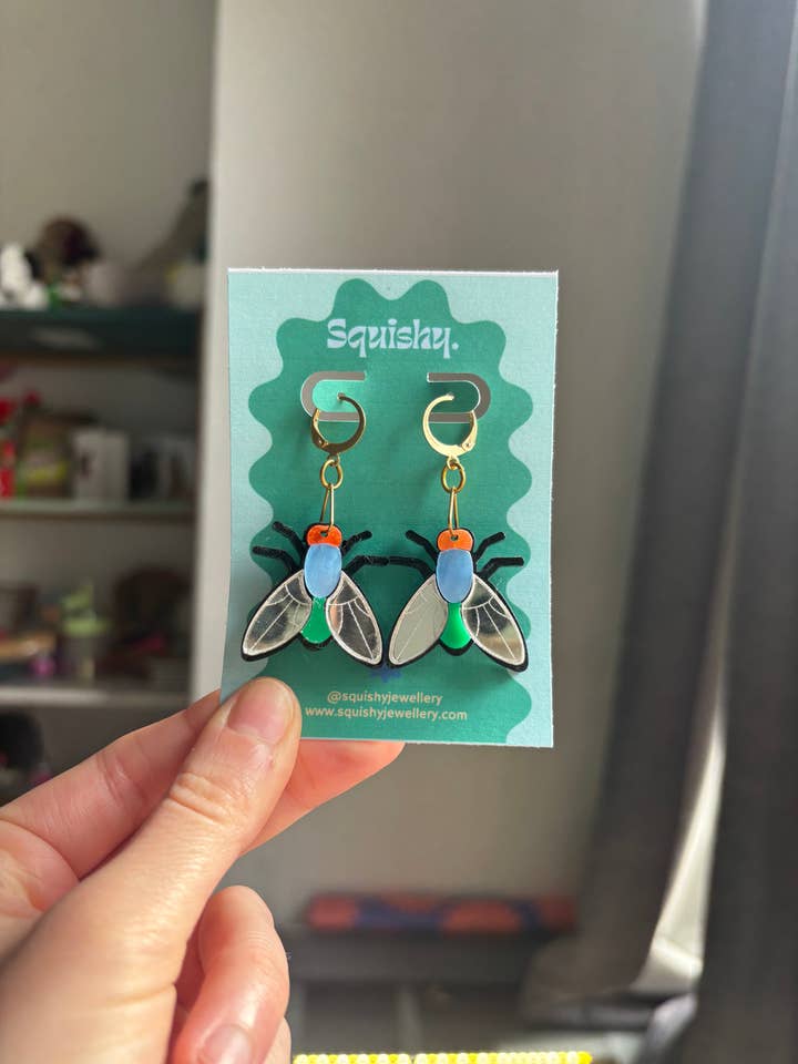 Multicolor Silver Acrylic Fly Earrings: Whimsigoth Bug Statement Huggie Hoops Gifts for Nerds Medium Size for wholesale by Squishy Jewellery