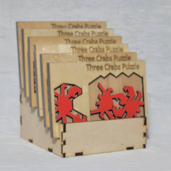 Palmetto Puzzle Works - Venta al por mayor Puzle - Adultos - Puzzles con estante de exhibición recargable de madera