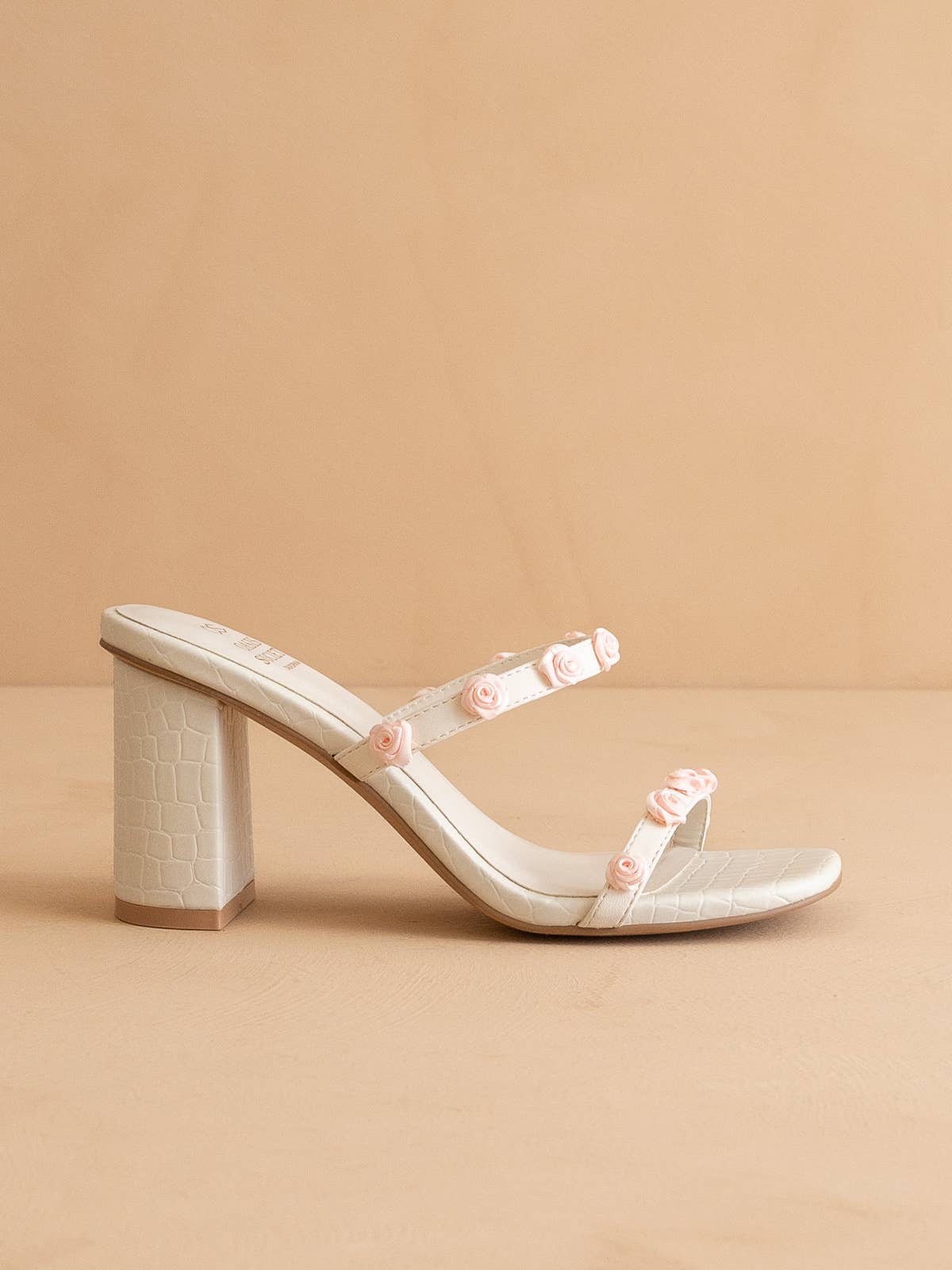 The Nia White | Rosette Adorned Heel for wholesale on Faire0