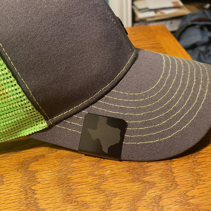 DK LaserWorx - Wholesale Hat Accessory - Men's - Cap Clipz Featuring a Cap Brim Clip Shotgun Shell Graphic1