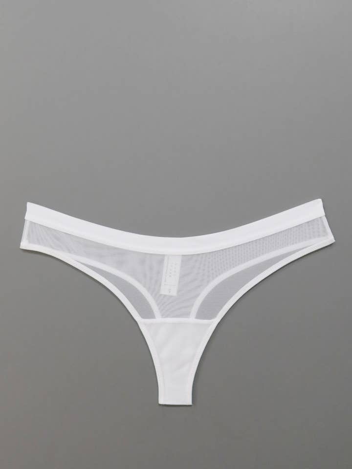 Emery Thong in White for wholesale by MARY YOUNG