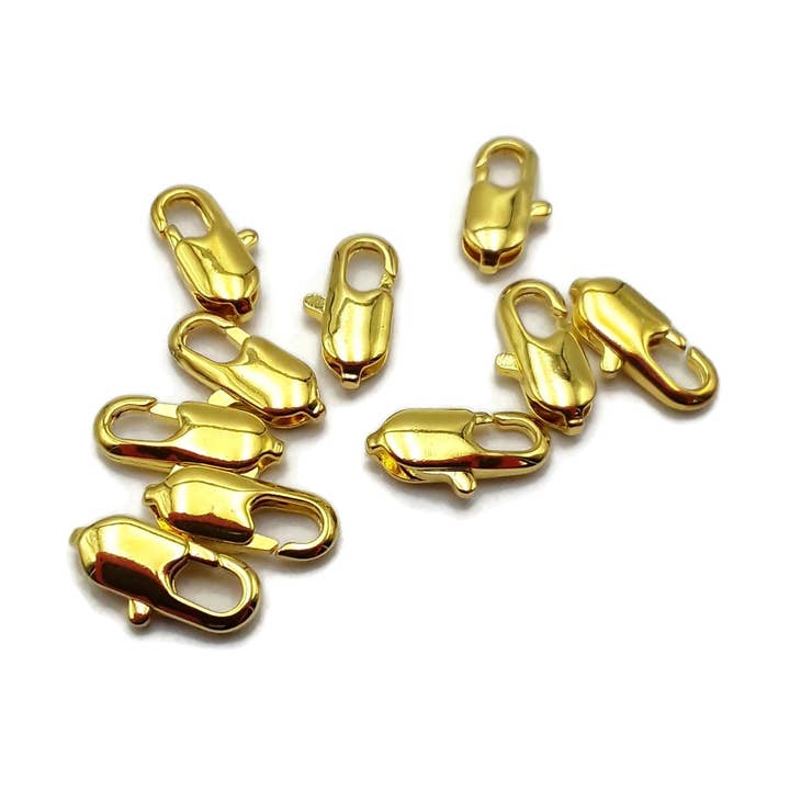 10 stk. guldbelagte hummerklo-låse størrelse 7x14mm sælges pr. pose for engroshandel hos CRCBEADS