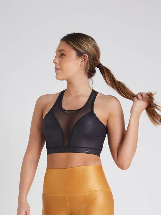 Top nero con trasparenza OWfit per la vendita all'ingrosso da parte di Owfit