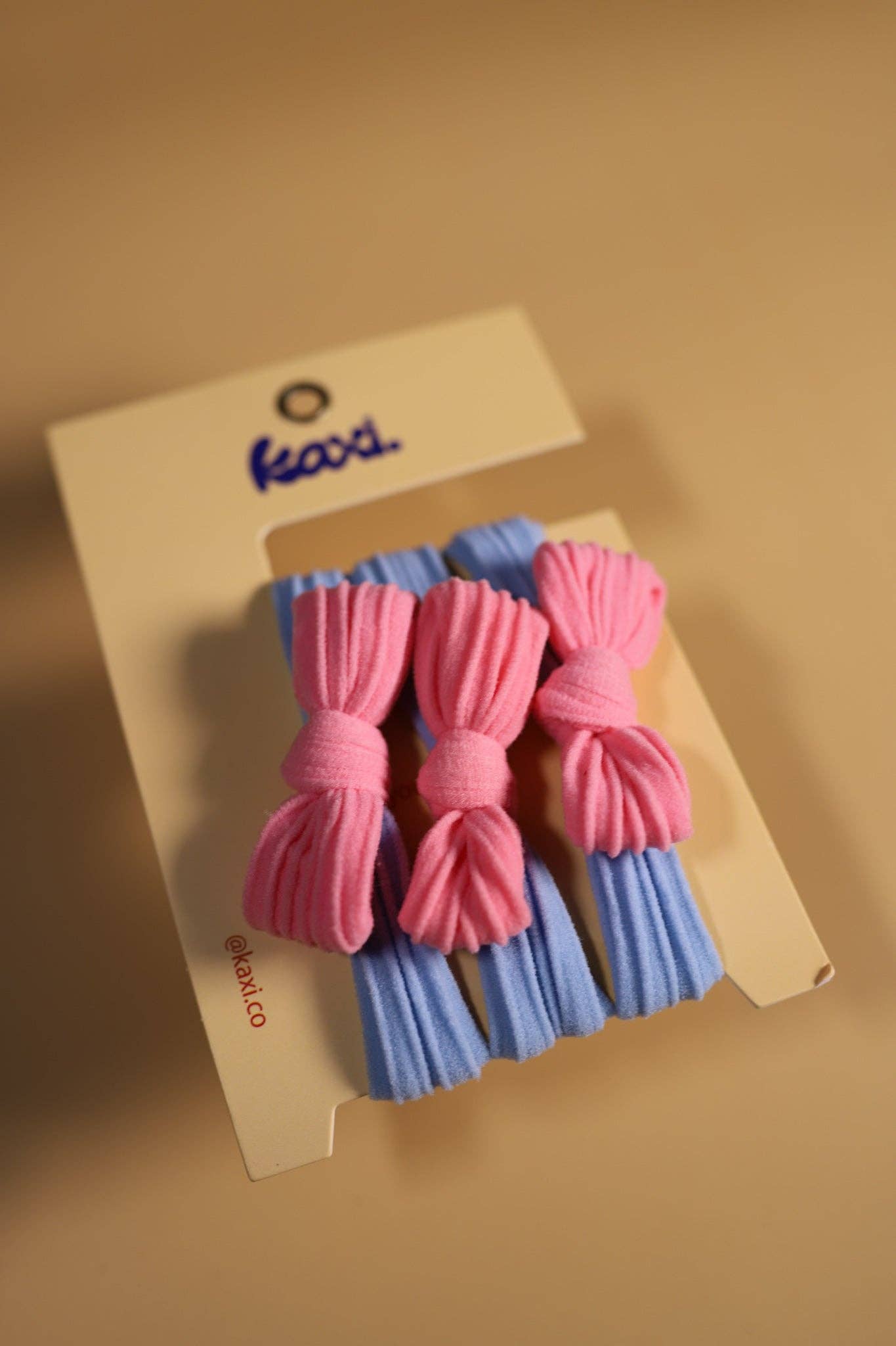 KAXI – wholesale Hårsnoddar – Dam – Tvåfärgade rosetter med bakåtslickat hårband5