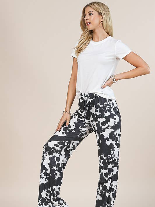 AV1044-ABBY COW PRINT RELAXED FIT LONG PANTS for wholesale on Faire1