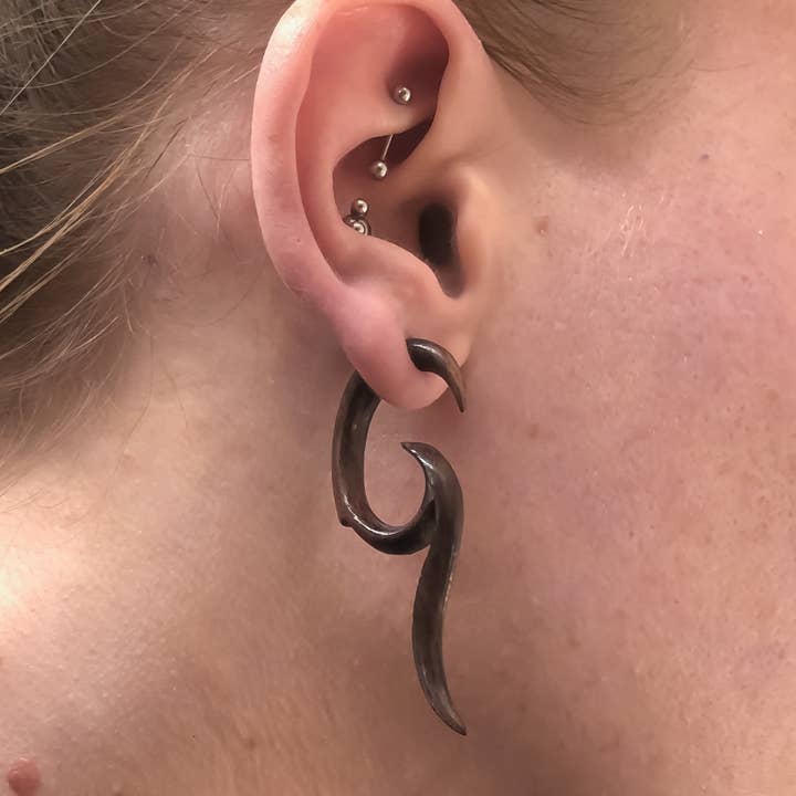 Swirled Spikes Faux Gauges ~ hand carved wood, fake gauged and other Purchase Wholesale fake vines. Free Returns & Net 60 Terms on Faire trending on Faire.