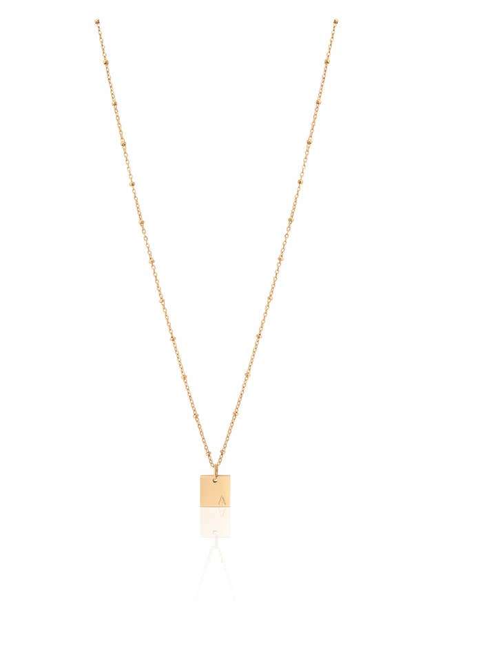 Collier en forme de lettre en perles pour la vente par House of Jewels Miami