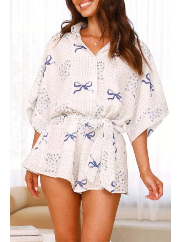 Blue Ribbon bow printed oversized Button short sleeve romper for wholesale on Faire