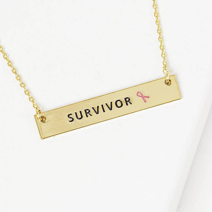 Breast Cancer Awareness halskæde med 'SURVIVOR' vedhæng for engroshandel hos OHBOOBA DESIGN