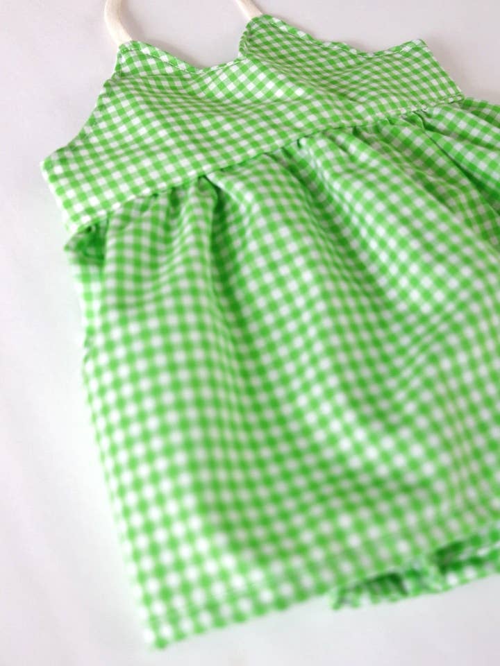 Green Gingham Peplum for wholesale by The Baby Bird Boutique