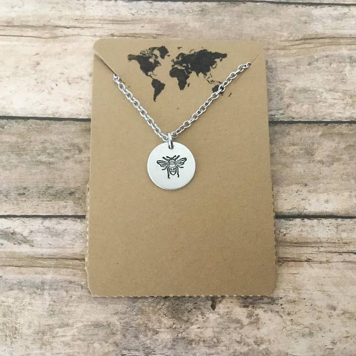 Bee small circular charm necklace in silver color for wholesale by Jamie Haley Designs