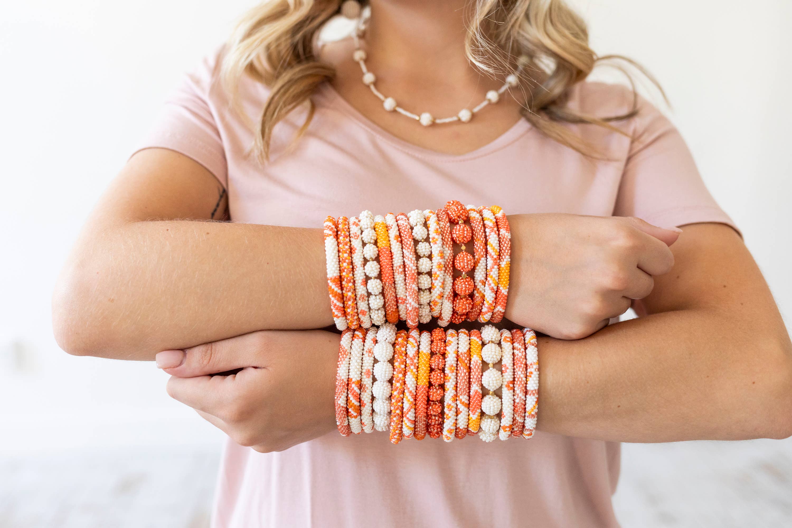 Aid Through Trade - Wholesale Jewelry Set - The Original Roll-On® Bracelet Tangerine - Set of 124
