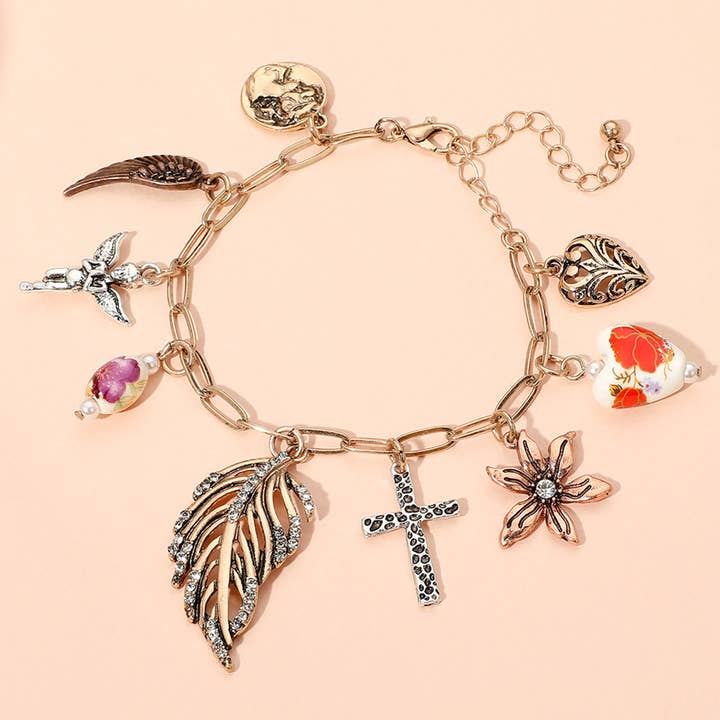 Feuille Fleur Ange Croix Cœur Aile Charme Station Trombone Chaîne Bracelet pour la vente par Sensibling Corp.