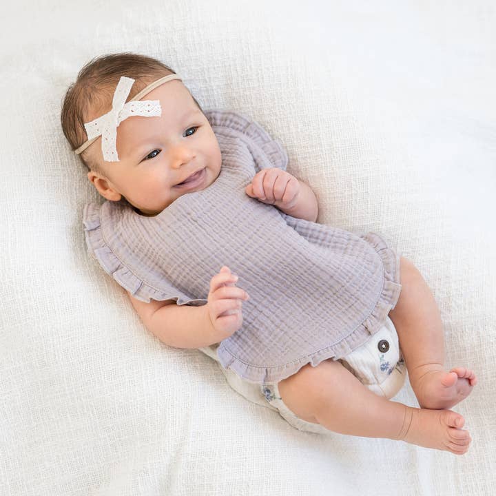 Organic Baby Muslin Ruffle Bib - Lilla and other Purchase Wholesale ruffle bib. Free Returns & Net 60 Terms on Faire trending on Faire.