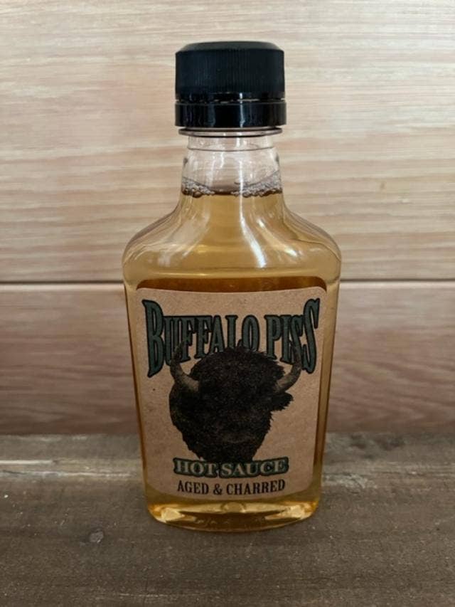 Buffalo Piss Aged N Charred Hot Sauce for wholesale by Fairhope Favorites, Inc.