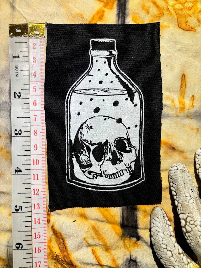 Skull in a Bottle patch. for wholesale by Three Raccoons
