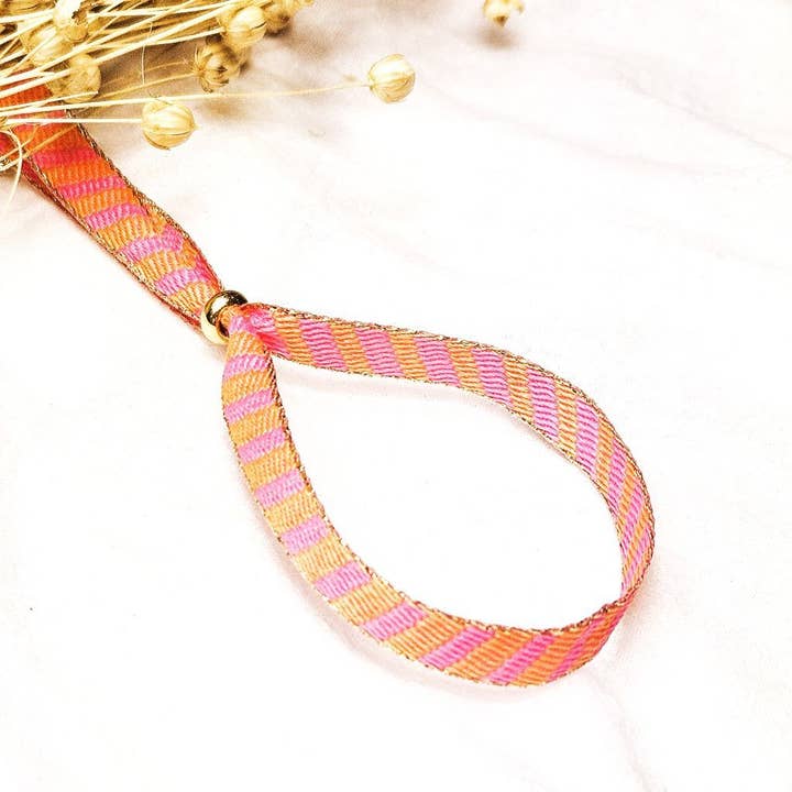 Pink/orange striped ribbon bracelet for wholesale by Ibiza Boutique