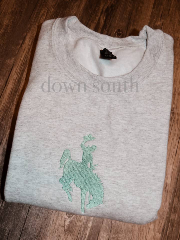 Bucking Cowboy Embroidered Sweatshirt for wholesale by Down South Apparel and More