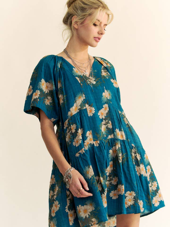 Teal Blue FLORAL PRINT SHORT BELL SLEEVE PLEATED MINI DRESS for wholesale on Faire