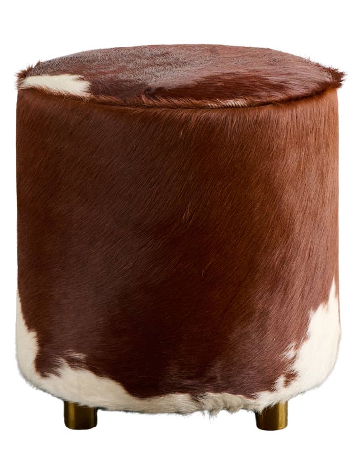Round Cowhide Ottoman for wholesale by The Art of Creating Inc