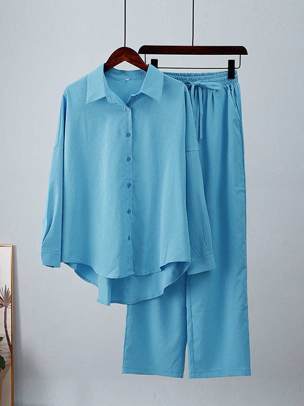 Plush Looks - Wholesale Set met top en broek (GEEN Loungewear) - Dames - Effen gekleurde splitjoint, hoge en lage mouwen, revers met knoopsluiting, top met trekkoord en elastische plooibroek aan de onderkant, set van twee stuks3